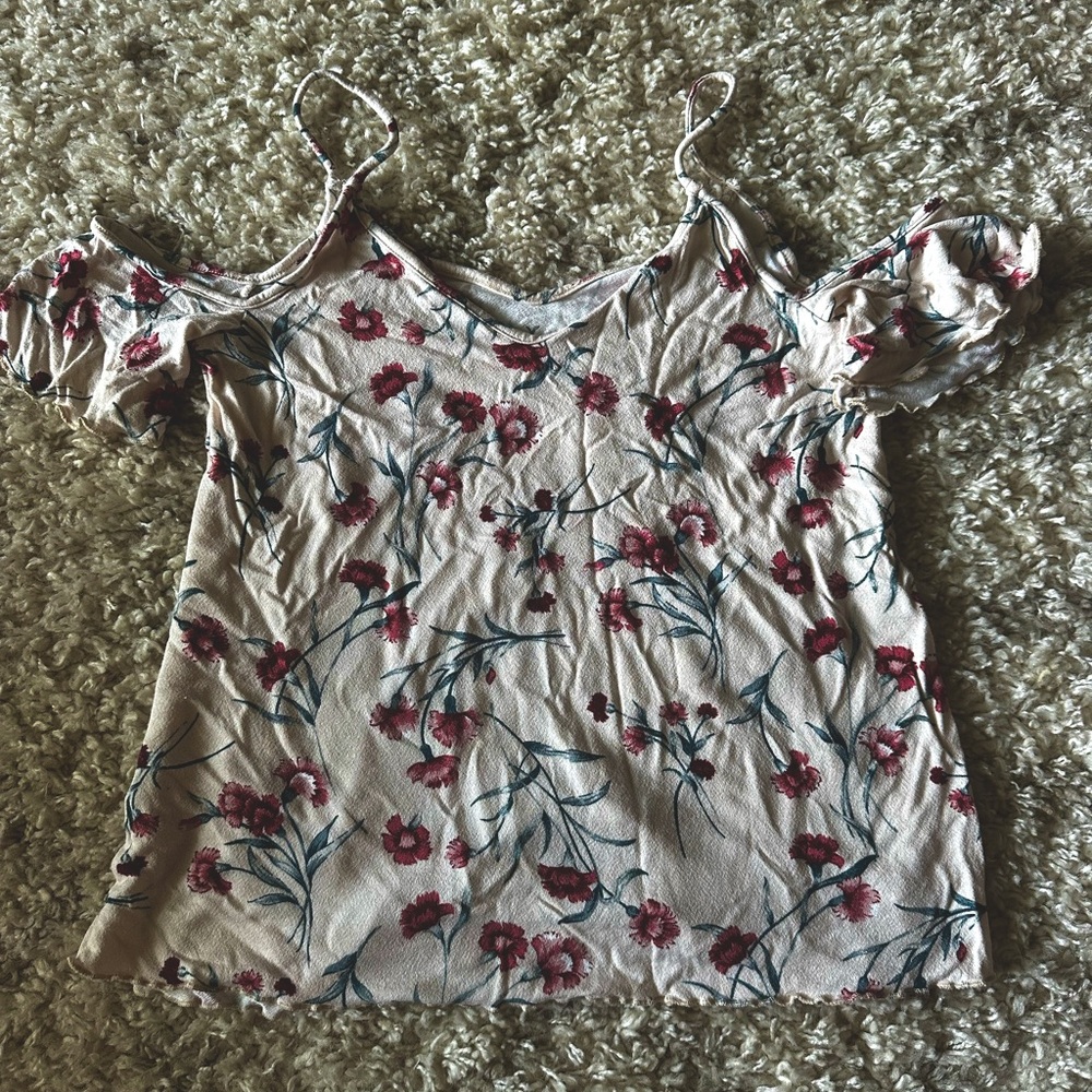 American eagle shirt with cut out shoulder.
